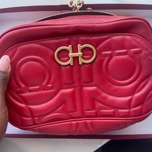 Red crossbody Ferragamo bag with dust bag